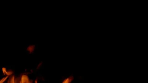 Dynamic Fire Flames Dancing Vividly Against a Dark Background, Creating a Captiv Foto stock