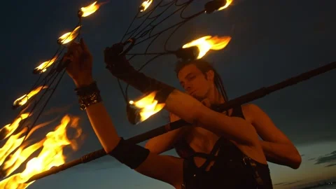 Dynamic fire show. Sexy couple perform poi dance blue sky. Poi performance. Fire Stock Footage
