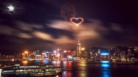 A dynamic fireworks display over Hong Kong's vibrant cityscape Stock Footage 344106285