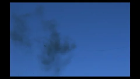 Dynamic Flak Smoke Drift Compositing Element Against Blue Background Stock Footage 335914640