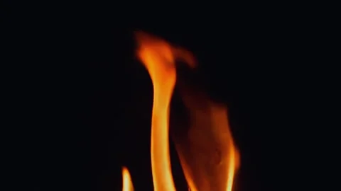 Dynamic Flames Dancing on a Deep Dark Background Evoking Intense Emotions and Stock Footage 295890266