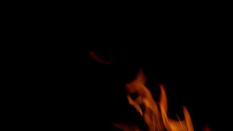 Dynamic Flames Dancing Elegantly in the Depths of Darkness and Shadows All Aroun Stock Photos