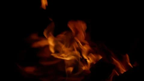 Dynamic Flames Gracefully Dancing in the Darkness, Creating a Mesmerizing Displa Stock Photos