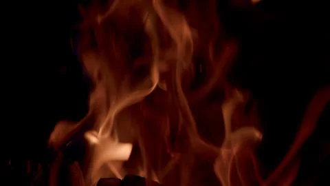 Dynamic Flames Gracefully Dancing in the Embracing Darkness of the Night Sky Abo 写真素材
