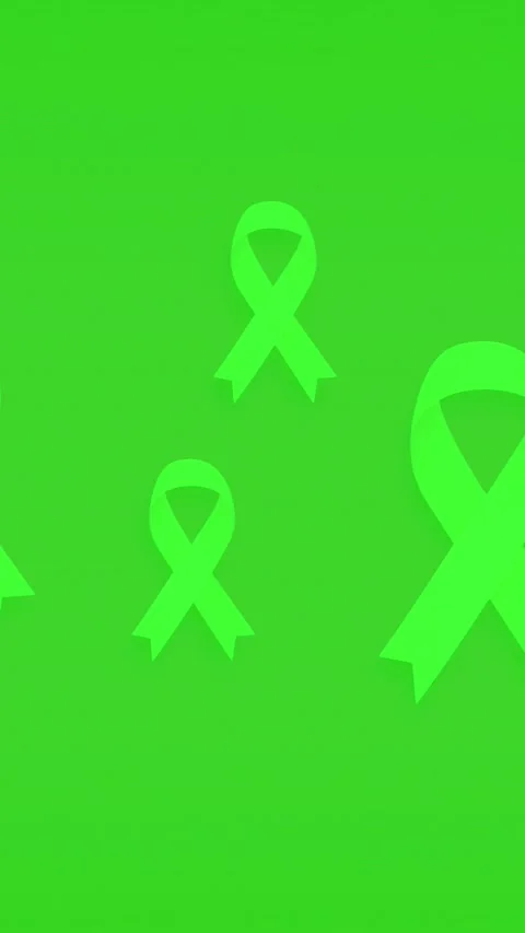 Dynamic floating green awareness ribbons animation on green background for menta Stock Footage 348546074