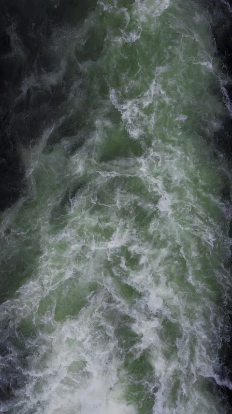 Dynamic Flow of Turbulent Green Water in Norway's Captivating Beauty Stock Footage 296010507