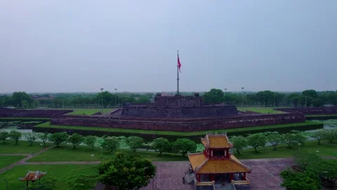 Dynamic Fly-Up and Tilt-Down Drone Shot of Hue Citadel Flagpole 스톡 동영상 276932161