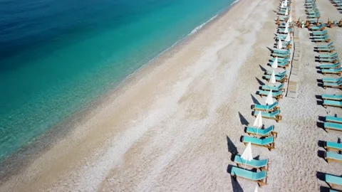 Dynamic fly over the Oludeniz beach with sun loungers and turquoise sea Stock Footage 193095785