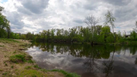 Dynamic footage of clouds over a river in northern Europe Stock Footage 193673530