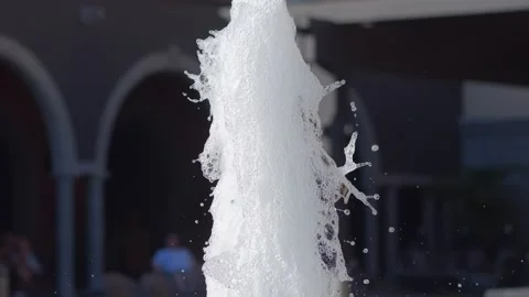 Dynamic fountain spray in front of a classical structure in 4k slow motion .. Видео 265004397