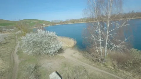Dynamic FPV Drone Flight Small Beach at Lake Summer Nature Cinematic 4K Stock Footage 173544996
