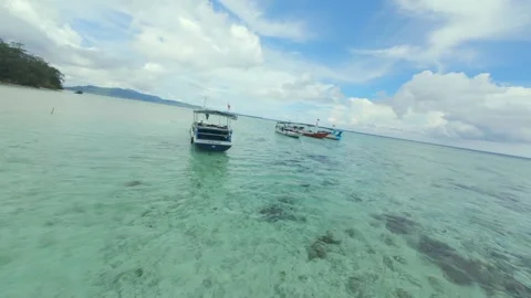 Dynamic FPV Drone Shot Soaring Over Pristine Tropical Beaches Stock Footage 321339291