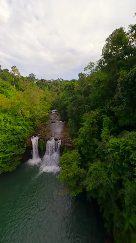 Dynamic FPV flight over river and waterfalls in the lush jungle in Thailand Stock Footage 264763925