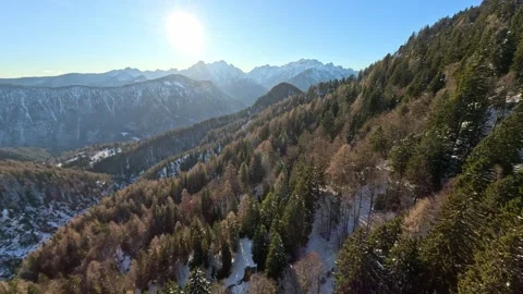 Dynamic FPV Flight: Proximity Flying Along Snowy Mountain Summits and Cliffs Stock Footage 321149691