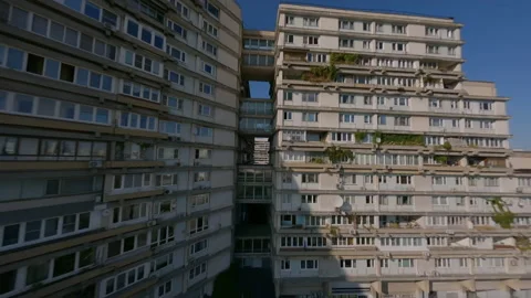 Dynamic fpv spans along and near multi-storey buildings, industrial cinematic Stock Footage 229725691