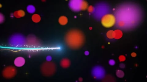 Dynamic glowing particle trails moving through multicolored abstract bokeh Vidéo 345331140