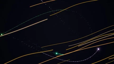 Dynamic Golden Light Trails and Particles on Black Stock Footage 332787460