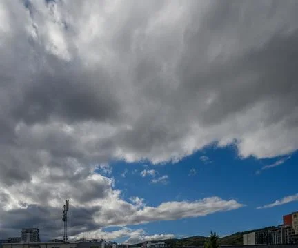Dynamic grey clouds and blue sky weather background Stock Photos