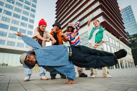 Dynamic group of talented dancers showcasing impressive break dance moves i.. Stock Photos