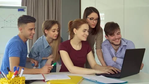 Dynamic group of young professionals collaborating in a modern office Stock Footage 311988595