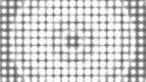 Dynamic Halftone Displacement Animation with Circular Patterns on a Black B.. Stock Footage 311788769