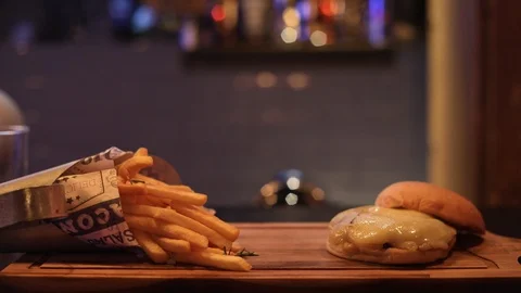 Dynamic Hands Putting Beverages into Chesseburger Combo Stock Footage 129043906