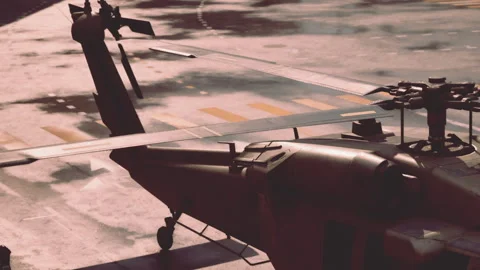 Dynamic Helicopter Stands Ready on the Runway in Bright Sunlight Stock Footage 344928783