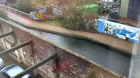 Dynamic High Angle Shot of the Rippling Canal and Urban Brickwork. 库存影片 72176734