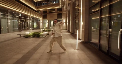 Dynamic hip hop dancer in night city Stock Footage 244474565