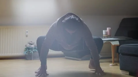 Dynamic Home Workout Engaging Advanced Fitness Pose in a Cozy and Comfortable Stock Footage 308927929