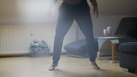 A Dynamic Home Workout Routine Featuring Various Squats and Effective Fitness Stock Footage 308663434