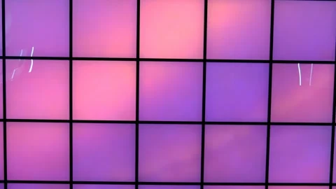 Dynamic illuminated wall panels with shifting pink/purple light Video stock 328663147