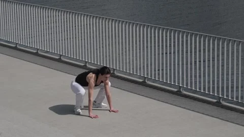 This dynamic image captures a woman in a push-up position, highlighting her Video stock 276732924