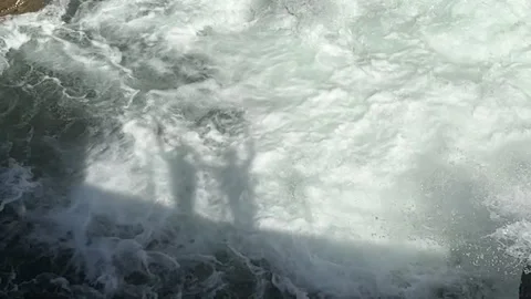 This dynamic image focuses on water splashes creating intricate patterns Stock Footage 314095745