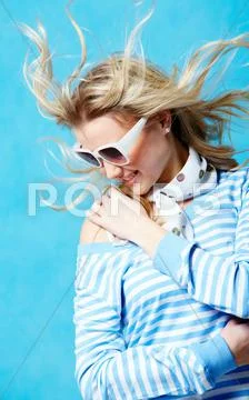 Dynamic image of stylish blonde wearing a stripy jacket Stock Photos