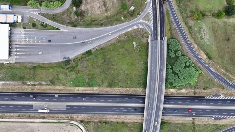 Dynamic Interchange of Modern Highways With Vehicles and Lush Greenery Under Video stock 281333178