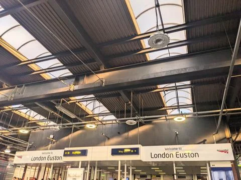 Dynamic Interior Architecture and Clear Way Out Signage at London Euston Railway Stock Photos