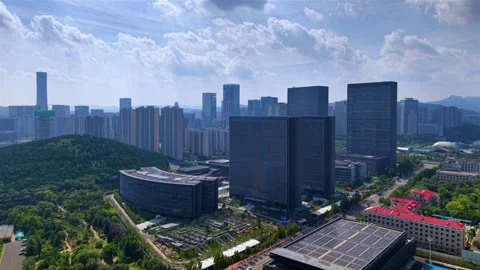 Dynamic Jinan CBD Aerial: Modern Skyscrapers &amp; Green Landscape Stock Footage 331228308