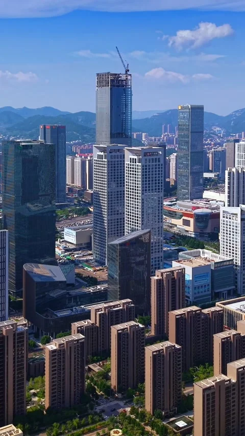 Dynamic Jinan Cityscape: Modern CBD Skyscrapers Against Blue Sky Stock Footage 331228679