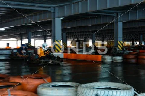 Dynamic karting competition at speed with blurry motion on an equipped raceco Stock Photos
