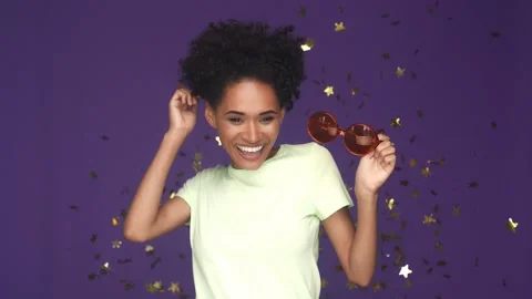 Dynamic lady hold sunglass dance floor isolated violet color background Video stock 165878136