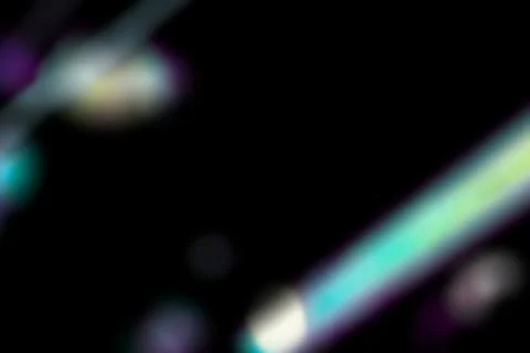 Dynamic lens flare and rainbow prism effect on black background. Colorful Stock Illustration
