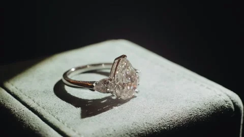 Dynamic light illuminates the beautiful precious ring. Close‑up shot. Stock Footage 343796832