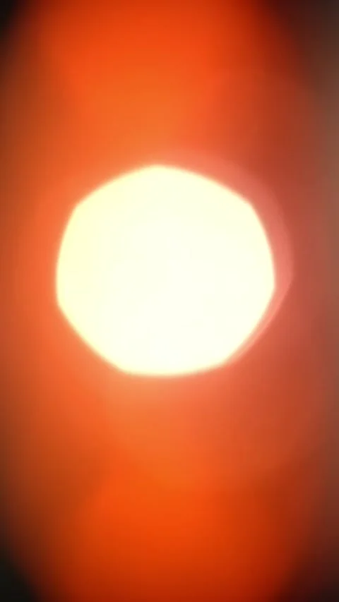 Dynamic Light Leak Forming a Circle Overexposed Bokeh on Dark Background. 動画素材 305871727