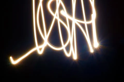 Dynamic light trails dancing across a dark canvas Stock Photos