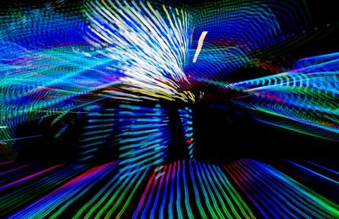 Dynamic light trails spreading vibrant colors Stock Photos