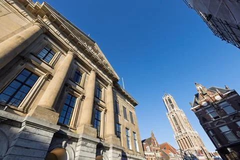A dynamic low-angle shot highlights city hall  architecture and the distant D Stock Photos