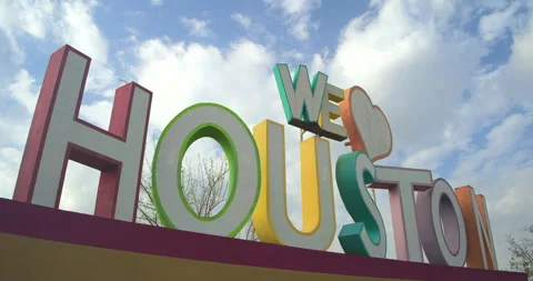 Dynamic low angle shot of "We Love Houston" sign Stock Footage 303784437