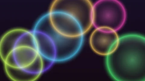 Dynamic, luminous circles float against a dark, abstract backdrop Stock Footage 327946323