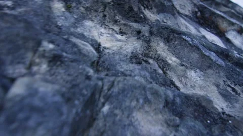 Dynamic macro shot of the frozen rock of a cliff at dawn, Alps, Switzerland Stock Footage 240129807